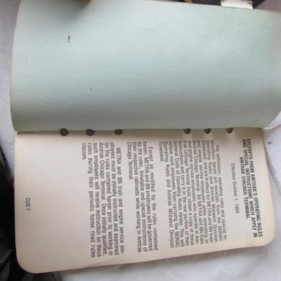 Lot 527:  Vintage Consolidated Code of Operating Rules Railroad Info, and Metra Amtrak Bookelt