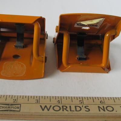 Lot 574:  Two Older Nisson Wheel Chock