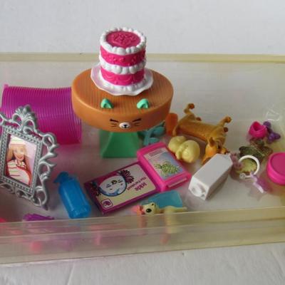 Lot 591:  Vintage and New Barbie Doll Size Toys