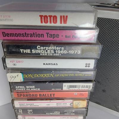 Great music on cassette tape - some classics!  with sturdy black handled case