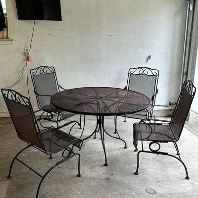Iron Table & Four (4) Rocker Chairs