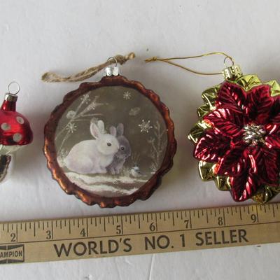 Lot 629:  Three Figural Glass Christmas Ornaments