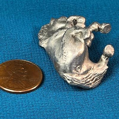 SMALL PEWTER SITTING HORSE FIGURINE