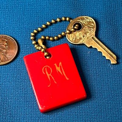 VINTAGE BAKELITE CHERRY RED KEY FOB & COOL EMBOSSED LION KEY