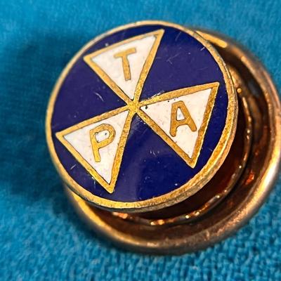 ENAMELED â€œT.P.A.â€ TRAVELERS PROTECTIVE ASSOCIATION LAPEL PIN