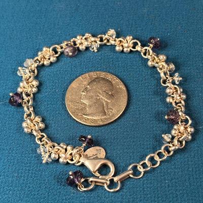 STERLING DANGLY BRACELET WITH CLEAR, PURPLE, SILVER BEADS SIGNED ?