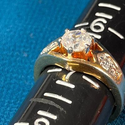 FANCY GOLD TONE, RHINESTONE SOLITAIRE RING MARKED THAILAND