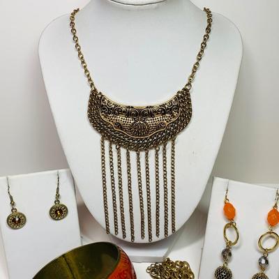 LOT 45: Orange & Brown Bangle Bracelets, Orange/Red Bangle, Gold Tone Necklaces, Earrings & More