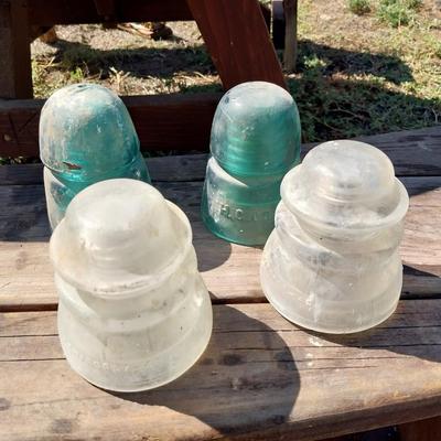 GLASS INSULATORS WITH A VINTAGE TORCH AND CAST CANON