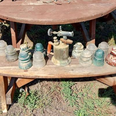 GLASS INSULATORS WITH A VINTAGE TORCH AND CAST CANON