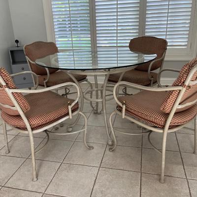 GLASS TOPPED TABLE AND 4 CHAIRS