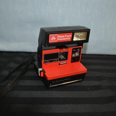 LOT 24.  VINTAGE POLAROID STATE FARM INSURANCE CAMERA
