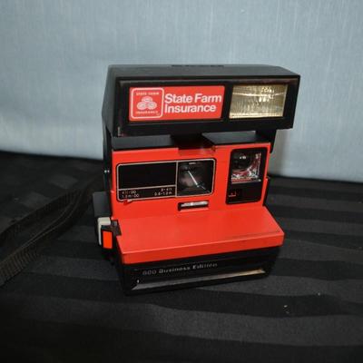 LOT 24.  VINTAGE POLAROID STATE FARM INSURANCE CAMERA
