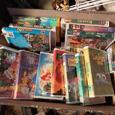BOX FULL OF MOSTLY WALT DISNEY MOVIES IN CLAM SHELL CASES