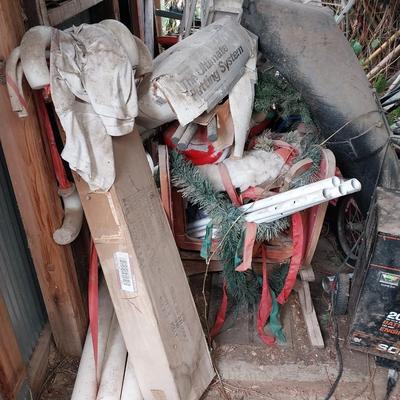 METAL SHED W/RIDING LAWN MOWER, BATTERY CHARGER, SANTA BLOW MOLD AND MORE