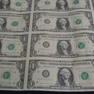LOT 45. UNCUT SHEET OF  32 US ONE DOLLAR BILLS