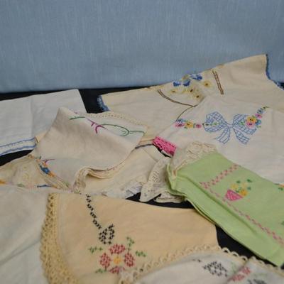 LOT 55. LUMBER YARD APRON AND EMBROIDERED VINTAGE LINENS