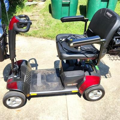 Lot #247  PRIDE GO GO scooter - like new - also has motorized car carrier