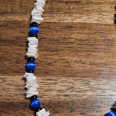 Aa: Hematite Eagle Pendant Necklace and Puka Shell Necklace