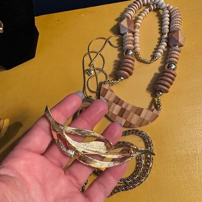 Leaf Brooch, gold belt, and chunky wooden necklace