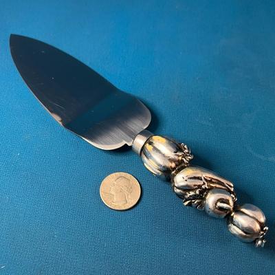 STAINLESS OFF-SET SERVING SPATULA WITH 3-D HARVEST FRUIT MOTIF HANDLE