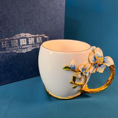 FANCY ENAMELED, JEWELED TEA CUP AND SPOON IN SATIN LINED BOX