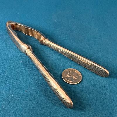 VINTAGE WELL-USED METAL NUTCRACKER TEXTURED HANDLE