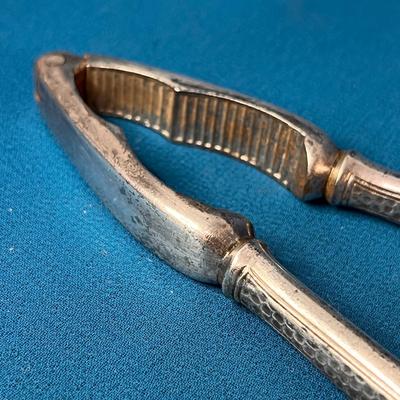 VINTAGE WELL-USED METAL NUTCRACKER TEXTURED HANDLE