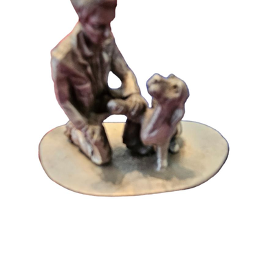 MAN AND DOG FIGURINE