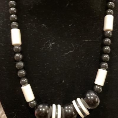 1 apple necklace; 1 black beaded necklace