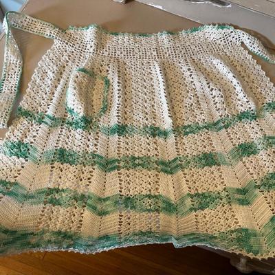 Crocheted apron and doilies