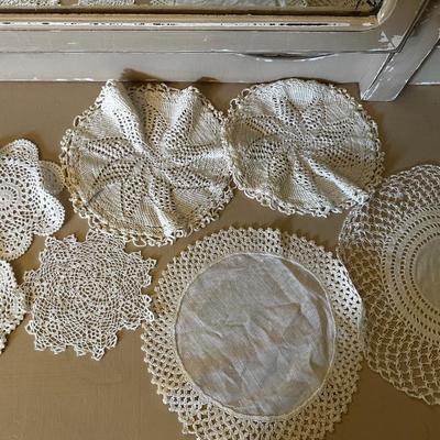 Crocheted apron and doilies