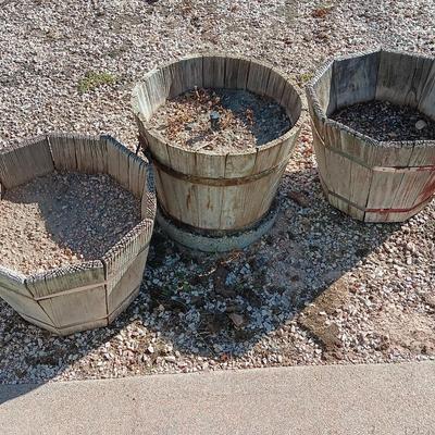 THREE WOODEN PLANTER BARRELS