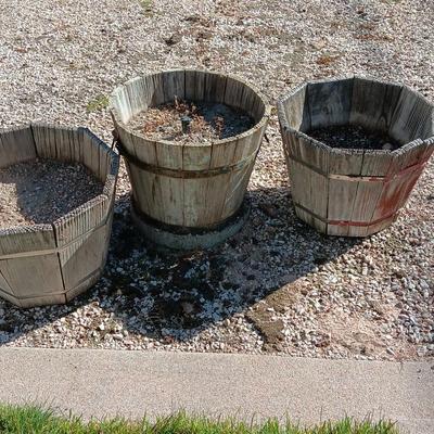 THREE WOODEN PLANTER BARRELS