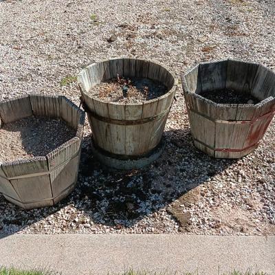 THREE WOODEN PLANTER BARRELS