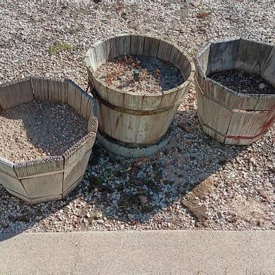 THREE WOODEN PLANTER BARRELS