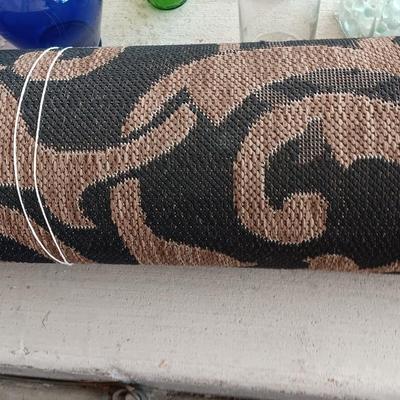 OUTDOOR AREA RUG WITH FOLDING SHOVELS AND CHEMICAL SPRAYER