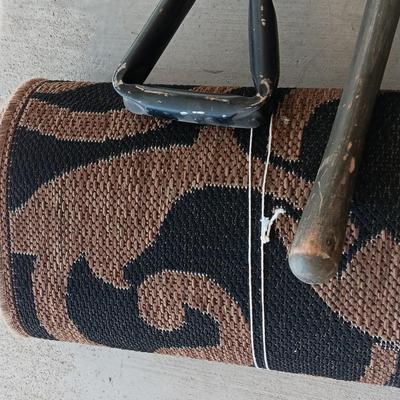 OUTDOOR AREA RUG WITH FOLDING SHOVELS AND CHEMICAL SPRAYER