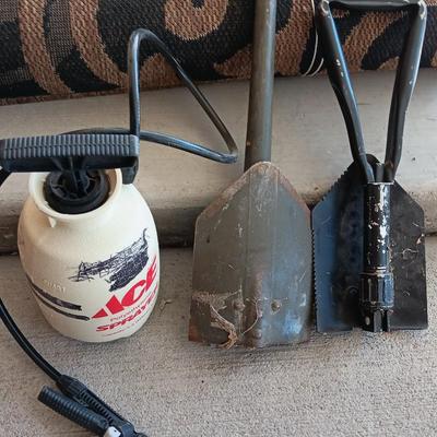 OUTDOOR AREA RUG WITH FOLDING SHOVELS AND CHEMICAL SPRAYER