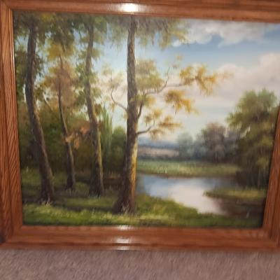 NICE FRAMED ARTWORK OF WOODS AND RIVER WITH METAL WALL ART LEAVES