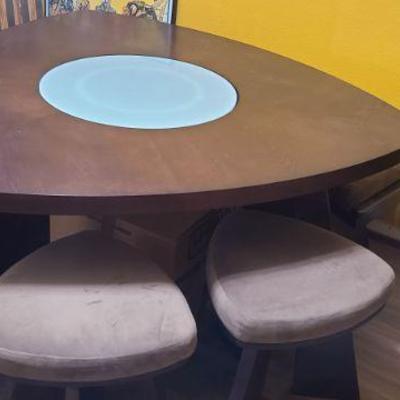 Kitchen Table Triad shape with solid wood. Glass Lazy Susan spins in the middle.