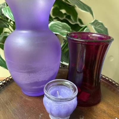 Purple vases and candle