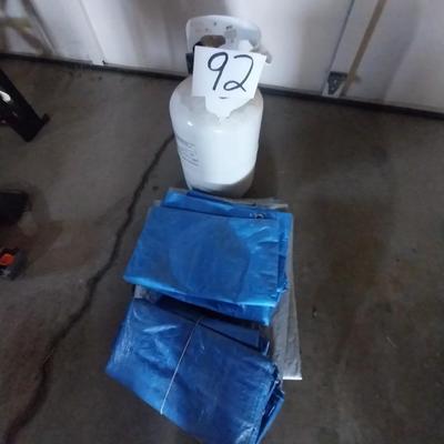 PROPANE TANK WITH PROPANE AND TARPS