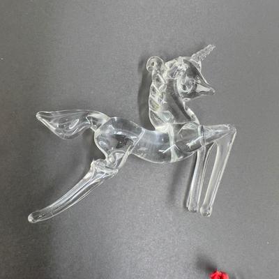 Lot 318. Lot of Four Clear Glass Unicorn Ornaments