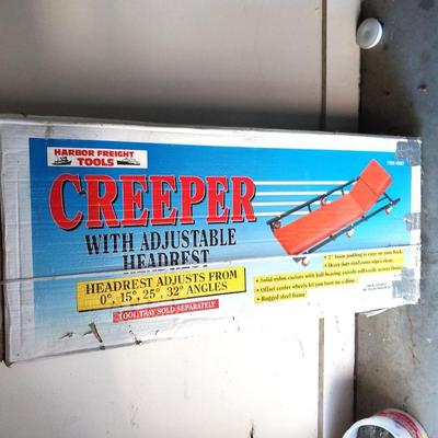 CREEPER WITH ADJUSTABLE HEADREST