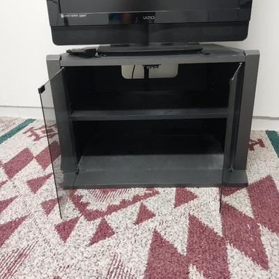 32"XIZIO WITH REMOTE AND GLASS FRONT STAND WITH STORAGE