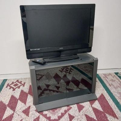32"XIZIO WITH REMOTE AND GLASS FRONT STAND WITH STORAGE
