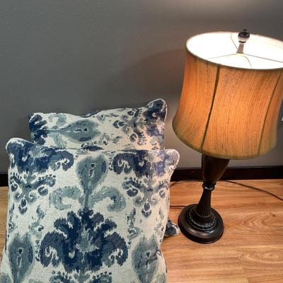 2 decorative pillows and lamp