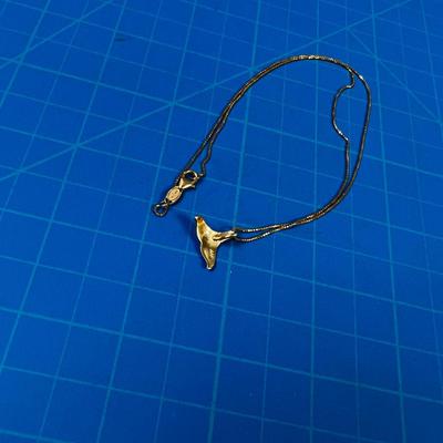 14 K Whale Tail Pendant on a chain. DARLING 