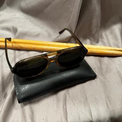 Vintage sunglasses and drumsticks